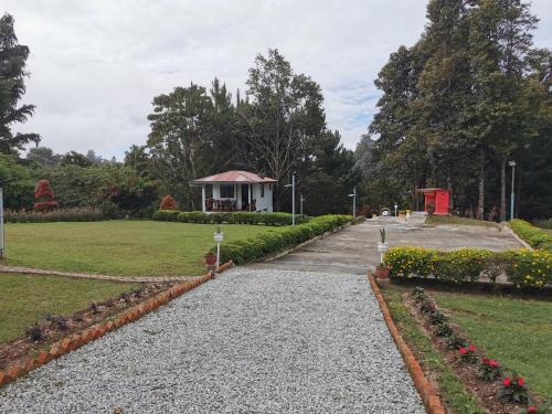 a walkway leading to a pavilion in a park at Dear Dino Villa Cameron Highlands in Cameron Highlands