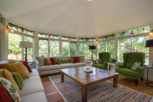 a living room with couches and chairs and a table at The Eaglehawk Country House Hotel - Rent your own Hotel in Maldon