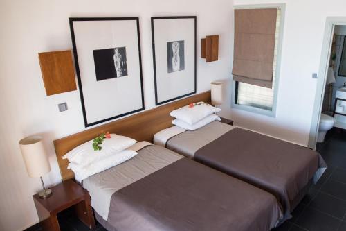 Postel nebo postele na pokoji v ubytování Hotel Esplanada