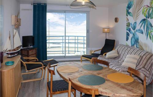 a living room with a couch and a table at 1 Bedroom Nice Apartment In Wimereux in Wimereux