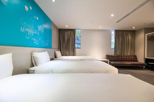 Ένα ή περισσότερα κρεβάτια σε δωμάτιο στο Wholesome Hotel