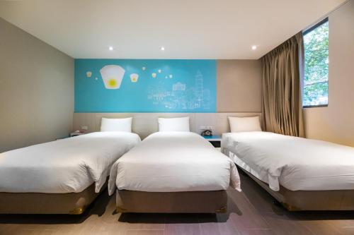 Ένα ή περισσότερα κρεβάτια σε δωμάτιο στο Wholesome Hotel