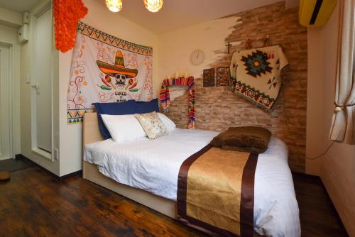Postel nebo postele na pokoji v ubytování Comfy Stay Sakuramachi