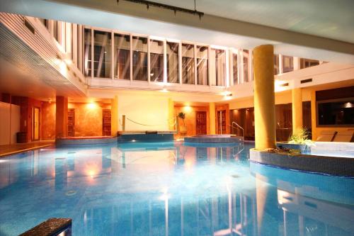 a swimming pool in a hotel with two pools at Grand Rose SPA Hotel in Kuressaare