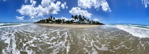 an island in the middle of a body of water at Residencial Mañanero in Cabarete