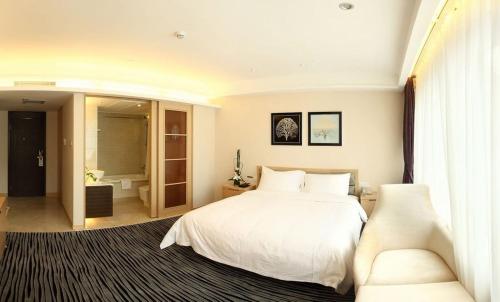 Katil atau katil-katil dalam bilik di Shenzhen Shekou Honlux Apartment (Sea World)