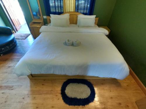 Postel nebo postele na pokoji v ubytování AURORA GUEST HOUSE
