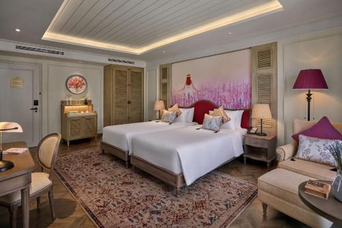Postel nebo postele na pokoji v ubytování Mercure Dalat Resort