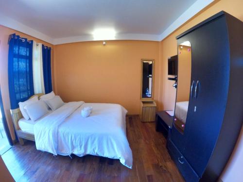 Postel nebo postele na pokoji v ubytování AURORA GUEST HOUSE