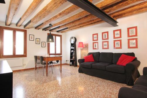 a living room with a couch and a table at City Apartments Cannaregio in Venice