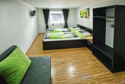 a small room with two beds and a couch at Chaloupka víno sklep U Palečků in Zaječí
