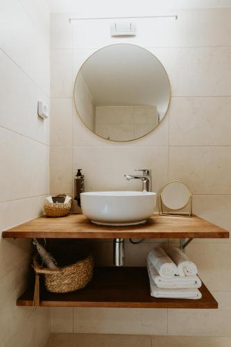 a bathroom with a sink and a mirror at Palm Boutique Hôtel Nice in Nice