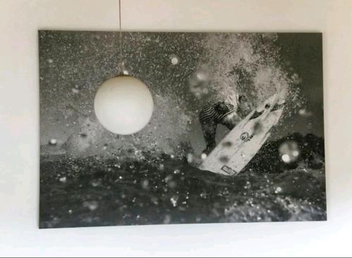 a black and white photo of a person on a snowboard at ¶Beautiful Pet Friendly Bedroom Room+TV + Wifi Pet Friendly in Glenfield