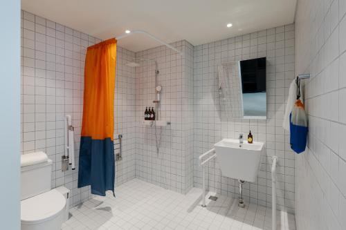 a bathroom with a toilet and a sink at Mangrove Dongdaemun in Seoul