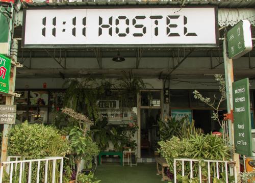 a sign for a garden store with plants at 11:11 Hostel in Phra Nakhon Si Ayutthaya