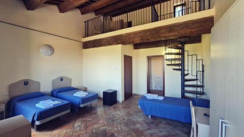 Postel nebo postele na pokoji v ubytování Borgo de' Varano by Hotel I Duchi