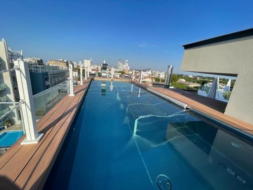 a swimming pool on the top of a building at Almalux Jesolo Wellness & Spa 3 stelle superior in Lido di Jesolo