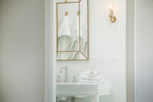a bathroom with a white sink and a mirror at dimore di portadibasso in Peschici