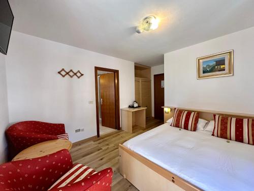 Postel nebo postele na pokoji v ubytování B&B Family Accommodation Canazei SKI-IN SKI-OUT
