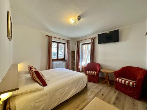 Postel nebo postele na pokoji v ubytování B&B Family Accommodation Canazei SKI-IN SKI-OUT