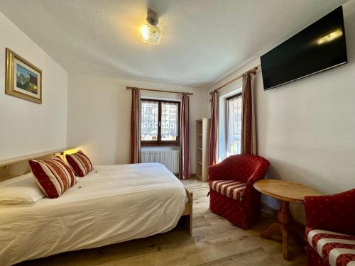 Postel nebo postele na pokoji v ubytování B&B Family Accommodation Canazei SKI-IN SKI-OUT