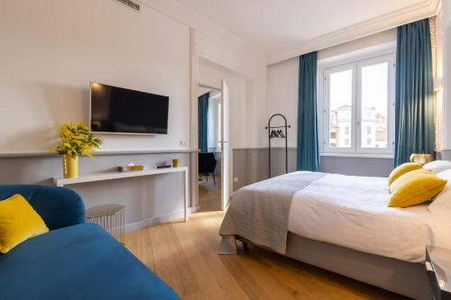 a hotel room with a bed and a tv at Navona 49 Luxury Suites&Apartment in Rome