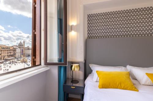 a bedroom with a white bed and a window at Navona 49 Luxury Suites&Apartment in Rome