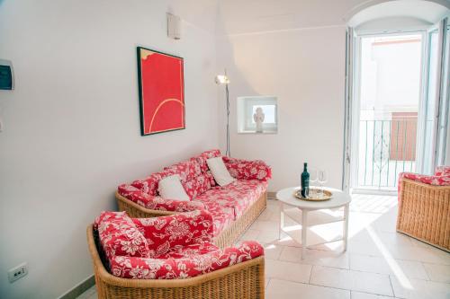 a living room with a couch and a table at dimore di portadibasso in Peschici