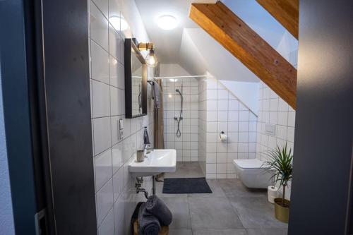 a bathroom with a sink and a toilet at Penzion 7 pokojů in Znojmo