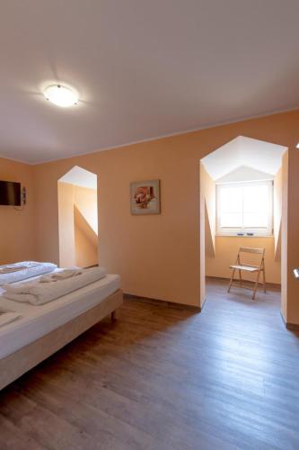 a bedroom with two beds and a window at Villa-Senta-Apartment-10 in Kühlungsborn