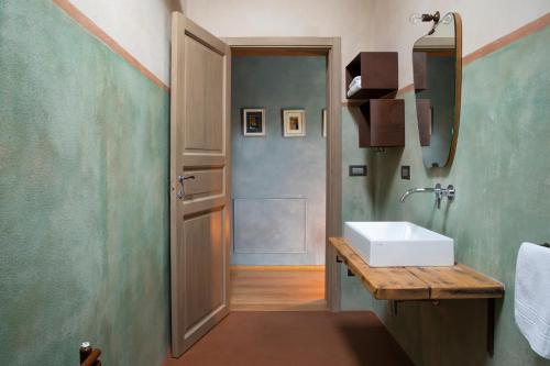 a bathroom with a sink and a mirror at * * * * * Splendida casa di campagna in Castenaso