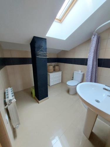 a bathroom with a sink and a toilet at Aromas del Jiloca in Calamocha
