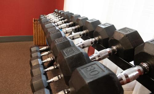 a bunch of dumbbells lined up in a row at Holiday Inn Express & Suites Ironton by IHG in Ironton