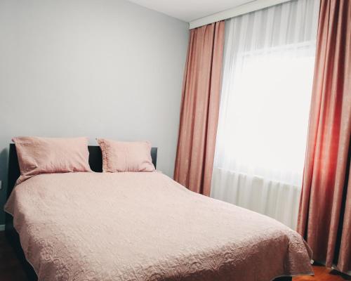 Postel nebo postele na pokoji v ubytování Parta Apartment