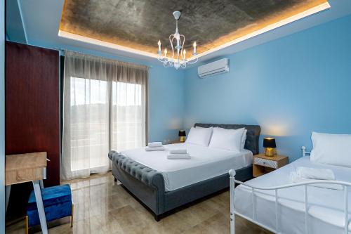 Ένα ή περισσότερα κρεβάτια σε δωμάτιο στο Alki Slow Living Villas