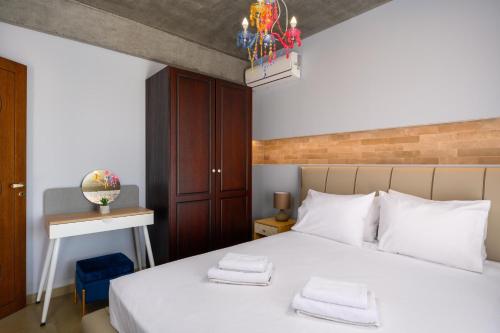 Ένα ή περισσότερα κρεβάτια σε δωμάτιο στο Alki Slow Living Villas