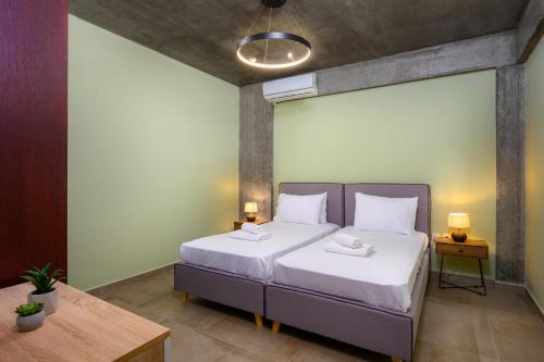 Ένα ή περισσότερα κρεβάτια σε δωμάτιο στο Alki Slow Living Villas