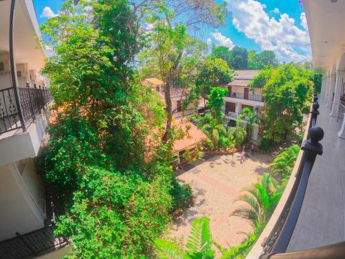 an overhead view of a garden from a balcony at Centauria City Hotel in Embilipitiya