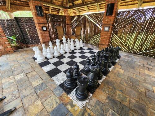 a chess board on a stone floor in a room at Ditholo Game Lodge Bela Bela in Bela-Bela