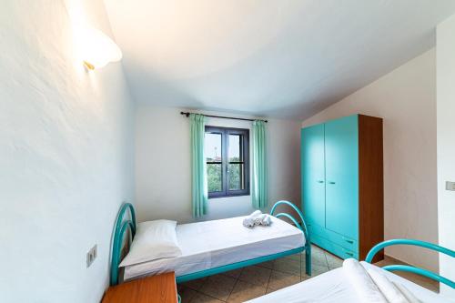 Ένα ή περισσότερα κρεβάτια σε δωμάτιο στο Residence Murta Maria Ataras