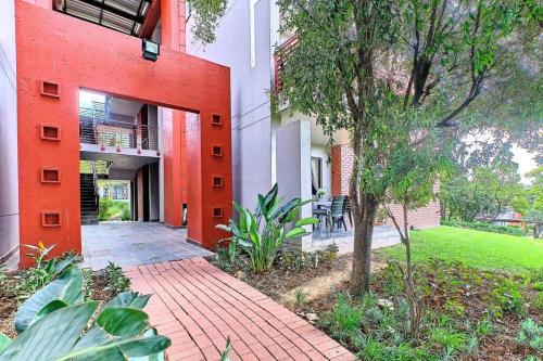 a brick walkway in front of a building at Estate Lifestyle+Inverter+Wi-Fi in Roodepoort