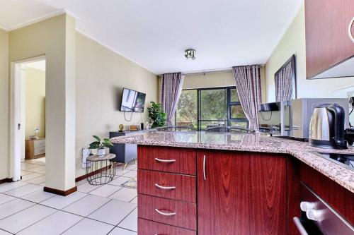 a kitchen with a large counter with a sink at Estate Lifestyle+Inverter+Wi-Fi in Roodepoort