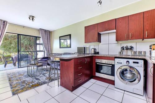 a kitchen with a washer and a dishwasher at Estate Lifestyle+Inverter+Wi-Fi in Roodepoort