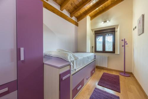 Ένα ή περισσότερα κρεβάτια σε δωμάτιο στο La Casonia