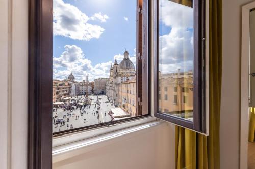 a view of a city from a window at Navona 49 Luxury Suites&Apartment in Rome