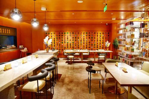 a restaurant with a bunch of tables and chairs at Atour Hotel Beijing Tiananmen Wangfujing Pedestrian in Beijing