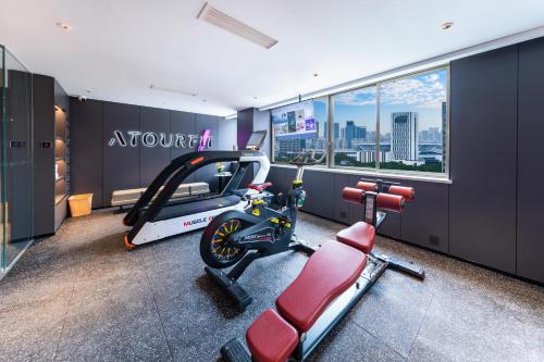 a gym with a treadmill and a exercise bike at Atour X Hotel Ningbo Railway Station Liuting Street in Ningbo