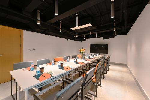 a large conference room with a long table and chairs at Atour Hotel Beijing Joy City Chaoyang Road in Beijing