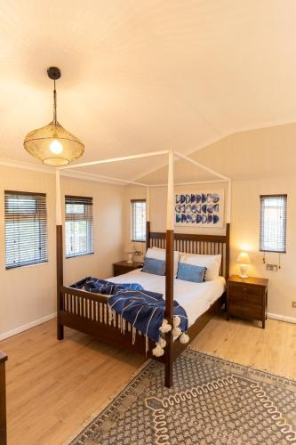 a bedroom with a bed with a canopy at Ribblesdale Park in Gisburn
