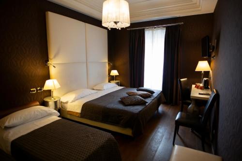 Postel nebo postele na pokoji v ubytování LH Hotel Andreotti